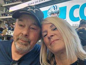 A man and a woman at a football game