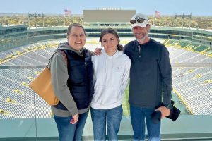 Three people at Lambeau Field